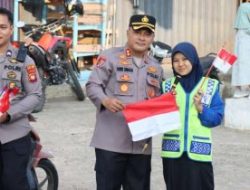 Kapolres Melawi Bagikan 200 Bendera, Semangat Kemerdekaan Membara di Jalan Juang